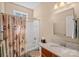 Cozy bathroom featuring a shower and tub combination plus a granite countertop and decorative shower curtain at 3100 Azalea Dr, Fort Mill, SC 29707