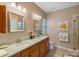 Bathroom featuring double sinks with granite countertops and a large mirror at 3100 Azalea Dr, Fort Mill, SC 29707