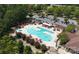Aerial shot showcasing a large community pool area with lounge chairs, umbrellas, and lush landscaping at 3100 Azalea Dr, Fort Mill, SC 29707