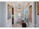 Inviting foyer with decorative mirror, tiled floor, and sunlit windows at 3100 Azalea Dr, Fort Mill, SC 29707