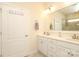 Bright bathroom featuring double sink vanity, large mirror, and tiled floors at 3102 Arches Bluff Cir, Lancaster, SC 29720
