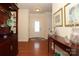 Welcoming foyer with hardwood floors, elegant decor, and a view of the front door at 3102 Arches Bluff Cir, Lancaster, SC 29720