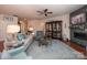 Inviting living room with a cozy fireplace, stylish decor, and comfortable seating, perfect for relaxation at 3102 Arches Bluff Cir, Lancaster, SC 29720