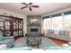 Comfortable living room with a decorative fireplace, ample natural light, and stylish furnishings at 3102 Arches Bluff Cir, Lancaster, SC 29720