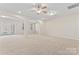Large finished basement area with arches, multiple lighting options, and carpeted floor at 3104 Streamhaven Dr, Indian Land, SC 29707