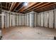Unfinished basement with exposed beams and concrete floor ready for customization at 3104 Streamhaven Dr, Indian Land, SC 29707