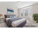 This virtually staged bedroom offers a calm and relaxing atmosphere at 3104 Streamhaven Dr, Indian Land, SC 29707