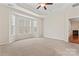 Spacious bedroom with tray ceiling and bay window overlooking the tree line at 3104 Streamhaven Dr, Indian Land, SC 29707