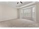 This bedroom offers a large bay window overlooking the tree line at 3104 Streamhaven Dr, Indian Land, SC 29707