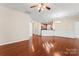 Dining area with hardwood floors, chandelier lighting, and easy access to the kitchen and patio at 3104 Streamhaven Dr, Indian Land, SC 29707
