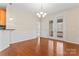 Dining area with hardwood floors, chandelier lighting, and french doors leading to patio at 3104 Streamhaven Dr, Indian Land, SC 29707