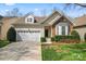 Charming home with a two-car garage, stone accents, and well-maintained landscaping at 3104 Streamhaven Dr, Indian Land, SC 29707