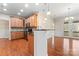 An inviting kitchen showcases granite countertops, wooden cabinets, and a modern island with seating at 3104 Streamhaven Dr, Indian Land, SC 29707