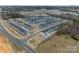 View of a neighborhood featuring newly constructed townhomes and modern street design at 3104 Timber Mill Dr, Matthews, NC 28104