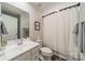 Bathroom featuring a white vanity with plenty of counter space, toilet, and shower at 3104 Timber Mill Dr, Matthews, NC 28104