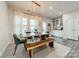 Modern dining room with table, wooden bench and pendant lighting at 3104 Timber Mill Dr, Matthews, NC 28104