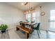 Bright dining room with a wooden dining table and bench seating at 3104 Timber Mill Dr, Matthews, NC 28104