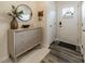 Inviting entryway featuring a round mirror, three-drawer cabinet, and stylish decor at 3104 Timber Mill Dr, Matthews, NC 28104