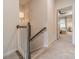 Upstairs hallway with a view into the bedroom at 3104 Timber Mill Dr, Matthews, NC 28104