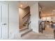 Hallway with carpeted stairs and an open view to the dining room at 3104 Timber Mill Dr, Matthews, NC 28104