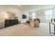 Comfortable living room with a couch, neutral decor, and a mounted TV at 3104 Timber Mill Dr, Matthews, NC 28104