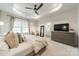 Bright main bedroom with tray ceilings, plush carpet, and large windows providing plenty of natural light at 3104 Timber Mill Dr, Matthews, NC 28104