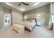 Spacious main bedroom with neutral tones, tray ceiling, and access to ensuite bathroom at 3104 Timber Mill Dr, Matthews, NC 28104