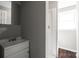 Bathroom featuring gray walls, white vanity and white shower at 326 Whispering Pines Dr, Charlotte, NC 28217