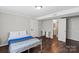 Bedroom with a bathroom, closet, and sleek hardwood floors offers practicality and comfort at 326 Whispering Pines Dr, Charlotte, NC 28217