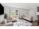 Inviting living room with neutral tones, comfortable seating, and hardwood flooring at 326 Whispering Pines Dr, Charlotte, NC 28217