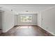Living room featuring wood floors, neutral paint, trim work and lots of natural light to create a peaceful sanctuary at 326 Whispering Pines Dr, Charlotte, NC 28217