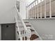 Elegant staircase featuring white railing and wooden steps at 326 Whispering Pines Dr, Charlotte, NC 28217