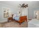 Bright bedroom features a wood-framed bed, ceiling fan, and two windows offering natural light at 36 Yorktown Nw St, Concord, NC 28025
