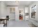 Dining area featuring built-in cabinets with glass doors, a wine fridge, and natural light at 36 Yorktown Nw St, Concord, NC 28025
