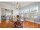 Bright dining room featuring hardwood floors, modern lighting, and clear acrylic chairs at 36 Yorktown Nw St, Concord, NC 28025