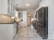 Modern kitchen with white cabinets, stainless steel appliances, and decorative tile flooring at 36 Yorktown Nw St, Concord, NC 28025