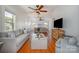 Spacious living room featuring hardwood floors, neutral decor, and a decorative fireplace at 36 Yorktown Nw St, Concord, NC 28025