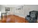 Bright living room boasting hardwood floors, large windows, and built-in shelving at 36 Yorktown Nw St, Concord, NC 28025