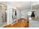 Mud room with built-in shelving, hall tree, and adjacent access to a bathroom with walk-in shower at 36 Yorktown Nw St, Concord, NC 28025