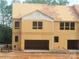Two-story DRB home under construction with an attached two-car garage at 4127 Walking Ridge Rd # 53, Charlotte, NC 28208