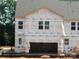 New construction home with a two-car garage, visible windows, and DRB Home wrap at 4127 Walking Ridge Rd # 53, Charlotte, NC 28208