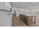 Spacious kitchen boasting white cabinets, a kitchen island, and stainless steel appliances at 4127 Walking Ridge Rd # 53, Charlotte, NC 28208