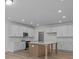 Modern kitchen with white cabinets, island, and stainless steel appliances at 4127 Walking Ridge Rd # 53, Charlotte, NC 28208