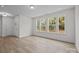 Inviting living room featuring hardwood floors, an entryway and a wall of windows at 4127 Walking Ridge Rd # 53, Charlotte, NC 28208