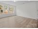 Bright living room with hardwood floors and large windows allowing natural light to flood the space at 4127 Walking Ridge Rd # 53, Charlotte, NC 28208