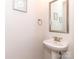 Bathroom featuring a single vanity with a framed mirror and pedestal sink at 426 Kenwood Vw, Indian Trail, NC 28079