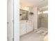 Bright bathroom featuring double vanity, framed mirror, and glass enclosed shower with neutral tiling at 426 Kenwood Vw, Indian Trail, NC 28079