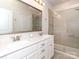 Bright bathroom with double vanity, white countertops, and large glass enclosed shower at 426 Kenwood Vw, Indian Trail, NC 28079
