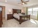 Warm bedroom with natural light, dark wood furniture, and neutral carpet at 426 Kenwood Vw, Indian Trail, NC 28079