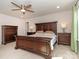 Warm bedroom with natural light, dark wood furniture, and neutral carpet at 426 Kenwood Vw, Indian Trail, NC 28079